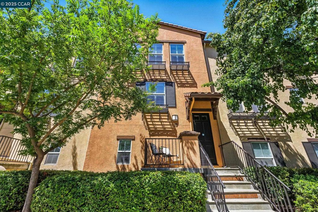 This immaculate & rarely available 2-bedroom w/ additional office/flex space, 3-bathroom townhome combines luxury & convenience in one of Walnut Creek’s most desirable neighborhoods. Step inside to discover quality hardwood flooring, crown moldings, & plantation shutters throughout, creating a refined & welcoming ambiance. The remodeled kitchen is a chef’s dream, featuring granite countertops, a custom-designed tile backsplash, stainless steel appliances, & under-cabinet lighting for added style & function. Each bedroom offers a walk-in closet with the primary bedroom featuring an en-suite bath with a separate shower stall & tub, ensuring comfort & privacy. The flexible bonus room boosts added cabinetry & is ideal for a home office, gym, or guest space. Additional highlights include a laundry room w/ additional cabinetry & added shelving, an epoxy-finished 2-car garage w/ added storage racks, abundant storage, & fire sprinklers. Perfectly situated near BART, major freeways, scenic parks, top-rated Walnut Creek schools, downtown Walnut Creek, and the exclusive Bay Club fitness center—this home is the epitome of modern suburban living. Enjoy the small development of only 16 units! Don't miss your chance to own this stylish & move-in ready townhome in a location that has it all!