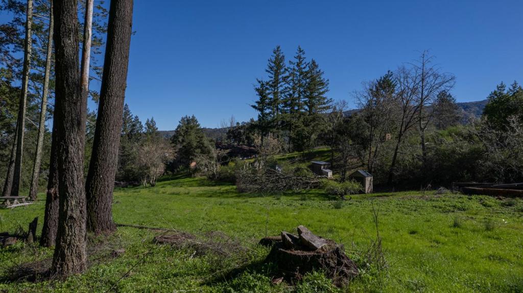 An extraordinary opportunity awaits at this stunning 1+ acre vacant lot, boasting breathtaking views of Lexington Reservoir and gorgeous valley views. Situated in a coveted area known for its natural beauty and tranquil surroundings, this property is a rare find. With the site already cleared and prepped, it's ready for you to build the home of your dreams. Please note, there are 2 lots shown in some of these pictures. Lot has been staked out. Building site approval is in the renewal process with partial reviews completed. Buyer to verify feasibility of building and if desired, the continuation of current site plan. Water - shared well agreement and San Jose Water connection option.