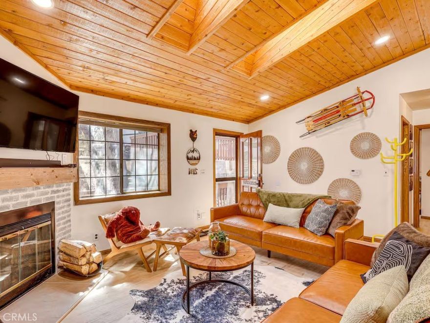 Welcome to 452 Orange Avenue, a beautifully updated 2-bedroom, 1-bath cabin tucked away in the quiet mountain community of Sugarloaf. This home combines rustic Big Bear charm with modern comforts, making it the perfect retreat, rental, or year-round residence.



Step inside to soaring vaulted ceilings with exposed wood beams, updated flooring, and a cozy fireplace that sets the tone for mountain living. The upgraded kitchen features butcher block counters, open shelving, and plenty of storage—ideal for home-cooked meals or entertaining guests.



Both bedrooms provide peaceful retreats, while the remodeled bathroom offers a modern spa-like touch. Outside, enjoy the fresh mountain air from your spacious deck and fully fenced yard. As a BONUS - Furniture can be included in the sale! 



Just minutes from Big Bear Lake, ski slopes, hiking trails, and The Village, this cabin is ideally located for adventure and relaxation. Whether you’re looking for a vacation getaway, an STR investment, or a full-time home, 452 Orange Avenue checks all the boxes.



Don’t miss this rare opportunity to own a turn-key cabin in the heart of Sugarloaf!
