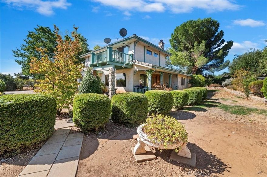 Nestled in the rolling hills of Banning, this property offers peaceful country living with the convenience of being close to town. Set on .91 acre, it enjoys sweeping mountain views and a picturesque gorge right across the street—an ideal backdrop for relaxing or entertaining.

Inside, you’ll find 3 bedrooms, 2 baths, and over 2,100 sq. ft. of living space. 

The light-filled living room greets you with a charming wood-burning fireplace and beautiful custom woodwork. The spacious primary suite features a private bath and walk-in closet, while two additional bedrooms and a full bath are conveniently located downstairs.

A 2-car attached garage provides direct access to the home, and a large detached garage/workshop offers plenty of room for hobbies, storage, or creative projects. Additional highlights include a durable tile roof, central heating and air conditioning, and abundant natural light throughout.

This home is a true diamond in the rough—sold as is and waiting for your cosmetic updates to make it shine. With nearly an acre of space, breathtaking surroundings, and a flexible layout, it’s a rare opportunity to create your dream retreat in the scenic hills of Banning.