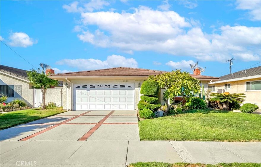 Charming Single-Level 4-Bedroom Home in a Prime Neighborhood

Pride of ownership shines in this lovely 4-bedroom, 2-bathroom single-level home, cherished by the same owner for over 30 years. The property offers a comfortable, flowing floor plan designed for both everyday living and entertaining.

Enter through a double door front entry into a welcoming foyer that opens to a sunken living room featuring a brick-faced fireplace, perfect for cozy evenings. The formal dining area sits just above, highlighted by an elegant chandelier and natural light filtering through custom window treatments.

The remodeled kitchen features white cabinetry, quartz countertops, and stainless-steel appliances, with a glass door leading directly to the backyard. It connects seamlessly to a spacious family room and breakfast nook, creating an inviting space for gatherings.

The home offers four generous bedrooms, each with mirrored closet doors. The primary suite features both a wall closet and a walk-in closet, along with an en suite bathroom that includes a glass enclosure. The hallway bathroom offers dual sinks and a shower over tub, providing comfort and convenience for family and guests.

Additional features include crown molding, custom draperies, dual pane windows, central A/C, hallway storage cabinets and an attached two-car garage with direct access and laundry hookups.

Outside, the home boasts a beautifully landscaped front and backyard with mature trees and well-tended gardens—perfect for outdoor relaxation.

This home offers a rare opportunity to own a lovingly cared-for property in a desirable, welcoming community.
