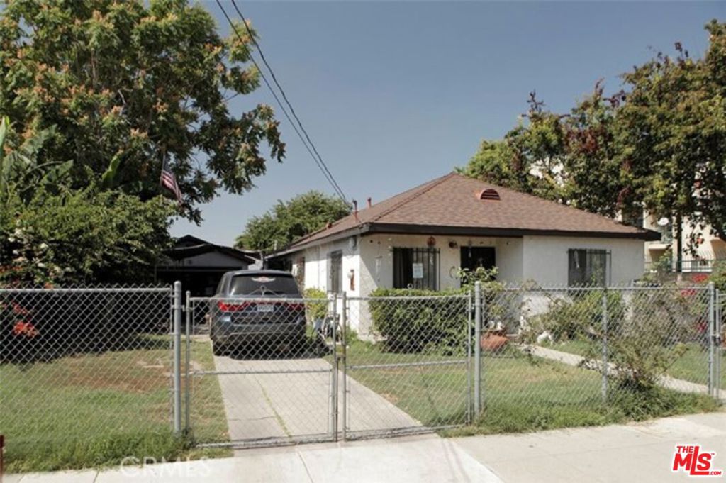 Great Multi-Residential Income Property - That features a spacious Single Family Front Home with 4 bedrooms and 2 baths. Separate driveway and detached 2 car garage. Both rear units are 1 bedroom and 1 bath, with separate driveway and attached 1 car garage each. Total covered parking is 4. Enclosed yard with trees and garden flowers. Community is is revitalizing, convenience of public transportation, shops, dining and family entertainment is nearby. Great Opportunity for income or live in one and rent others. Do Not Disturb Occupants.