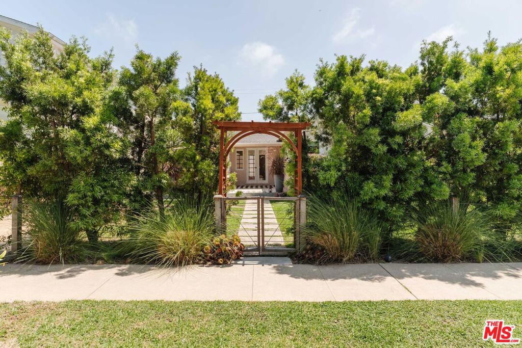 Set on a quiet, tree-lined street, this inviting traditional home with a separate guest house blends character, comfort, and modern updates. The 1,179-square-foot main residence welcomes you through a lush front garden and patio into bright, open living spaces. A remodeled kitchen with center island connects seamlessly to the dining and family areas, where French doors bring in abundant natural light. Just outside, a large deck overlooks a grassy yard and lower terrace, perfect for entertaining or relaxing. The primary suite features an updated bath, dressing area, and direct access to the deck. Another bedroom and full bath complete the home, along with a laundry room, central air/heat, and off-street parking. The one-bedroom, 577-square-foot guest house features a full bath, updated kitchenette, and retractable glass doors that open to the garden. Close to top schools, the famed Mar Vista Farmers Market, coveted restaurants like Beethoven Market, and more. Don't miss the opportunity to call this charming and private house your home.