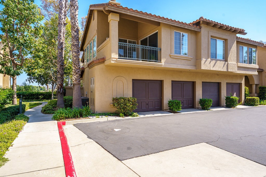 End unit upper level condo all on one level except garage is below. Nice location offering a spacious floor plan with stacked rock fireplace as a great center piece. It offers so many windows which bring in a lot of natural light all day! Light colored wood laminate floors and brand new white paint throughout. The kitchen has a great breakfast bar and granite counter tops, a stainless steel sink, a gas range and 8 recessed lights. Plenty of cabinetry and a large pantry for all your storage needs. Entertaining and relaxing is easy with the large covered deck just off the living room. The two bedrooms are all on the same floor as the living area making for a single story type living situation. The large primary bedroom offers high ceilings as well as a ceiling fan and a great walk-in closet. The second bedroom offers mirrored closet doors. Attached one car garage has direct access to the home with wood laminate stairs leading to the living area above. Garage also offers washer and dryer hook ups.