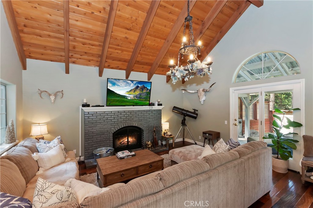 Lake Arrowhead located near Lake Arrowhead Country Club & Grass Valley Lake & Park this custom home has lots to offer. This 3 bedroom 3 bath home with an open floor plan and a 2 car garage offers the perfect blend of comfort, style, and functionality, the open floor plan is highlighted by a beautiful living room with soaring cathedral ceilings, rich wood flooring, and a cozy fireplace that anchors the spacious living room. The heart of the home is a thoughtfully renovated kitchen featuring sleek new cabinets, stainless steel appliances, and an open-concept design ideal for entertaining. Ample built-in storage throughout ensures convenience and organization, while a generous two-car garage provides practicality. Situated on a large lot, this property offers both indoor elegance and outdoor potential in one of the mountain’s most sought-after communities located in Arrowhead Woods with full lake rights