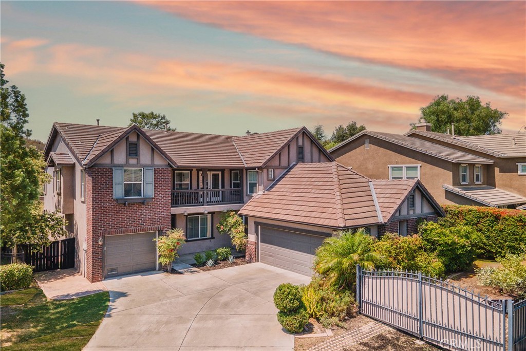 Step into refined California living with this beautifully reimagined Tudor-style estate, ideally located at the end of a peaceful, upscale cul-de-sac in the highly desirable Murrieta Oaks Hills community. Offering scenic hillside and valley views, gated RV parking, and an expansive ~0.2-acre lot, this home is a rare blend of classic architecture, modern convenience, and income-producing potential—currently generating $6,635 per month in executive housing rental income. Situated in a community with no HOA and close to award-winning schools and excellent medical facilities, this home also provides convenience and peace of mind.
Inside, you'll find five spacious bedrooms and four full bathrooms, thoughtfully laid out across a versatile floor plan that includes two expansive living areas, a formal dining room, a large bonus room, and a flexible space perfect for a home library, wellness retreat, or office. The oversized chef’s kitchen is a standout feature with a large center island, upgraded hood and custom cabinetry, brand new and newer appliances, and a trendy coffee lounge—ideal for everyday living or entertaining guests. Upstairs, a private balcony offers tranquil hillside views. There are two living spaces, including a formal living room and a large family room offering a special feature for sports and movie lovers: theater setup with retractable 110" screen and ceiling mounted projector system. The professionally landscaped backyard is a serene escape, inspired by classic English gardens and fully fenced for added privacy. Energy efficiency is a key highlight, thanks to an 8.4 kW solar system with 24 Longi panels—resulting in no power bills since 2022. Additional amenities include three garages, gated RV parking, and newer washer and dryer included with a full-price offer. Located within a top-rated school district and positioned in a Mello-Roos area, the home is just minutes from the 215 freeway, shopping, Old Town Temecula, dining, and the world-renowned Temecula wineries. For nature lovers, a private hiking trail is located just steps from the property. Professionally styled and offered fully turn-key, with furnishings negotiable, this remarkable home presents a rare opportunity to own a luxurious, income-generating estate in one of Murrieta’s most sought-after neighborhoods. Call today for your exclusive private showing. Come experience it for yourself—this one won’t last!