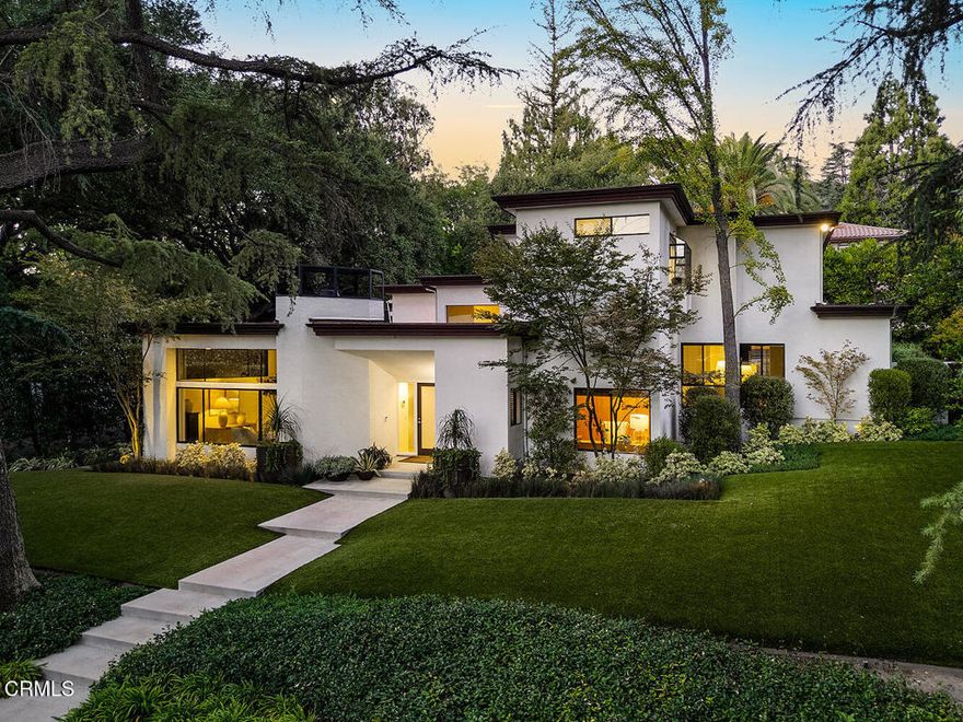 Framed by majestic deodar trees, this sculptural contemporary home blends architecturalsophistication and warm California modern living. Its striking frontage and manicured landscape offer instant curb appeal, while expansive glass walls fill the interior w/ natural light, blurring the line between indoors and out. Thoughtfully designed to frame tranquil garden views, each space embraces its lush surroundings, creating a serene, resort-like atmosphere where elegance and nature coexist in harmony. Located in one of the area's most desirable neighborhoods and within the award-winning La Canada Unified School District, this move-in ready home combines comfort, functionality, and design excellence. A flowing floor plan unites open gathering areas with private retreats, creating a seamless blend of livability and sophistication throughout. Four spacious bedrooms plus a flexible office with closet can serve as a fifth. Lauzon maple flooring, bespoke cabinetry, and European hardware highlight refined craftsmanship at every turn. One bedroom includes a built-in desk and custom Murphy bed with a quality mattress, offering dual convenience for guests or work-from-home living. Every room feels light-filled & thoughtfully connected, emphasizing calm, balance, and comfort through intentional design choices. The living and family rooms each feature gas fireplaces with recirculating systems and custom logs, adding warmth and ambiance while maintaining efficiency. The chef's kitchen serves as both a design statement and a culinary hub, featuring custom cabinetry, quartzite counters, top-tier appliances, and a fireclay sink with integrated filtration.Smart features include Nest thermostats, Kasa lighting, WiFi security, and a Rainbird irrigation system for effortless modern convenience. Outdoors, the sparkling solar-heated pool offers year-round enjoyment surrounded by sustainable turf, mature greenery, and complete landscape lighting. Multiple patios extend living spaces for entertaining, relaxation, & connection to nature in a peaceful, private environment. An attached garage, a rare feature in Southern California, provides direct access, generous custom storage, built-in electrical access, & a remote-operated door system for convenience & ease of everyday living.Perfectly positioned near shops, dining, hiking trails, & major freeways, this refined California Modern retreat offers tranquility, sophistication, & timeless appeal. Don't miss seeing this spectacular home!