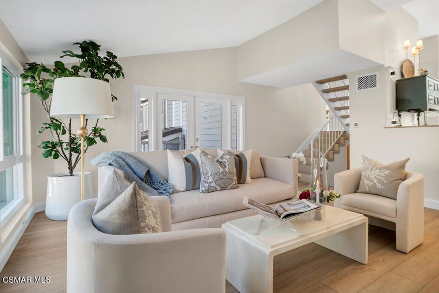 This exquisite home has been completely updated from top to bottom, featuring luxurious vinyl wood flooring, recessed lighting, and a dream kitchen with custom cabinetry, marble countertops, subway tile backsplash, built-in refrigerator, and professional-grade stainless steel appliances. The living room is a showstopper with its elegant fireplace and custom French doors that open to a large deck offering scenic views of the lush complex and a partial lake view. Adjacent to the kitchen, the spacious family room includes a second private balcony perfect for relaxing or entertaining. All windows and sliding doors have been replaced with energy-efficient upgrades, enhancing comfort and style throughout. Upstairs, the primary suite boasts stunning main channel lake views, two walk-in closets (including a cedar-lined one), and a spa-like en-suite bathroom featuring a custom vanity, marble countertops, and a beautifully tiled shower. The secondary bedroom also offers captivating lake views and mirrored wardrobe doors. The hallway bathroom includes an oversized soaking tub with elegant tile accents and a custom vanity. Additional highlights include a powder room on the entry level, a generous indoor laundry area with built-in cabinetry, a one-car attached garage with direct access, and an adjacent covered carport for added convenience. Community amenities are second to none enjoy two resort-style pools, a newly renovated clubhouse with a pool table and large-screen TV (ideal for entertaining), and a state-of-the-art fitness center. Three docks on the lake offer boat slips available on a first-come, first-served basis. The HOA covers insurance, all plumbing repairs, trash, water, cable, and high-speed internet. Live the lakefront lifestyle in Westlake Village one of Southern California's most desirable communities.