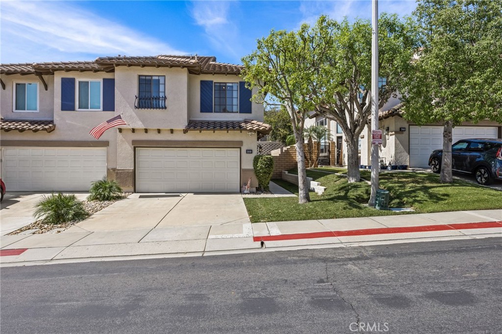 Welcome to this turnkey residence nestled in the COVETED, scenic community of SIERRA DEL ORO, adjacent to Yorba Linda. This beautiful two-story home offers 3 bedrooms, a LOFT, and 2.5 bathrooms. Upon entering, you will be greeted with soaring ceilings and a lot of natural light, with formal living and dining areas, and NEW INTERIOR PAINT. The kitchen is updated with GRANITE COUNTERTOPS and recessed lighting. Open to the kitchen, the common room is a perfect place for relaxation and comfort and has a COZY FIREPLACE. Open the doors from the common room to your PRIVATE BACKYARD PATIO with stamped concrete and a newer block wall. There is also a convenient downstairs 1/2 bathroom. Ascending the stairs, you'll find a LOFT OFFERING VERSATILE SPACE for work or leisure, along with additional cabinetry. The primary EN-SUITE bedroom is spacious, has a walk-in closet, and has doors leading to your own PRIVATE BALCONY. The bathroom has a dual-sink vanity, oversized soaking tub, and a separate walk-in shower. There are two additional SPACIOUS BEDROOMS upstairs along with another full bath. BRAND NEW NEUTRAL CARPET, ceiling fans throughout, and the home was RE-PIPED in 2024 offering you peace of mind for years to come. The COMMUNITY AMMENITIES include a swimming pool, picnic area, and toddler's playground. The home is just minutes away from shopping and two parks, one which has a splash pad. This residence's location provides seamless accessibility to Orange County, and is conveniently located near the 91 frwy, 241 toll road, 71 expressways, and the Metrolink Station. All furnishings are negotiable, and with TERMITE INSPECTION AND CLEARANCE in hand, what more could you ask for? This fantastic home offers a wonderful opportunity to buy in a desirable area of Corona. Low taxes and low HOA! Don't miss out on this opportunity to make this house your home!