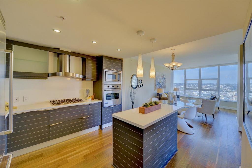 Enjoy sweeping views of Downtown San Diego and the Bay from this 18th floor NE corner residence. Built by Bosa Development in 2009, San Diego's premier luxury condo building developer. This residence features a large kitchen with Italian Snaidero Cabinetry, wine cooler and quartz countertops. Custom closets, expansive balcony. Amenities include a pool, sauna and steam room, gym, BBQ area, wine room, conference room, theatre room & guard on-site. Walking distance to Little Italy restaurants and hotels and just a block to the San Diego bay.