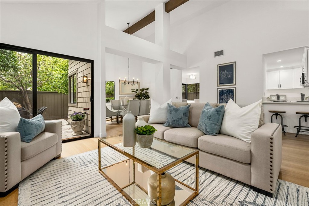What is it like to live in a charming, fully renovated, single-level residence nestled in a premier community on the shore of North Lake in Woodbridge? Imagine crossing the threshold and being captivated by the architectural beauty of cathedral ceilings and an open-concept floor plan. Contemporary chandeliers hang against the backdrop of freshly painted walls. While natural light floods in from windows through which lush foliage is seen.
Quality craftsmanship is reflected in the fully remodeled kitchen, where quartz countertops, soft-close cabinetry, a farmhouse sink, and stainless steel appliances make everyday living feel effortless. Luxurious vinyl plank flooring runs throughout. And beautifully updated bathrooms showcase quartz-topped vanities and modern finishes. Extensive storage systems in the attached, oversized 2-car garage generate a “wow” from all who enter, adding practicality to the home’s thoughtful design.
Refreshing ocean breezes blow gently into the backyard where five tall trees seclude you from the greenbelt beyond the fence. With no neighbors directly behind you, the tranquility of your private patios is perfect for savoring a morning cup of coffee or unwinding from a busy day.
Because the homeowner’s association enhances and maintains the common areas, streets, driveways, front yard landscaping, building exteriors, and roofs - along with providing insurance, you are relieved from most of the traditional maintenance of home ownership.
Within a block from your doorstep, find yourself at a pool and spa, or at the sandy beach lagoon enjoying boating and volleyball. Cross the iconic wood bridge with it’s mountain views and you quickly come to tennis and pickleball courts. Continue along the walking trail that encircles North Lake and its wildlife, or stop to relax with friends at the restaurants and shops of Woodbridge Village. Some might call this resort living, but you can call it home.
Tucked at the end of a quiet cul-de-sac, 4 Woodlake is the perfect blend of an established neighborhood with the ambiance of a new home. Whether you’re simplifying, downsizing, or just ready for a new chapter, this turnkey home awaits you, so schedule your private tour today.