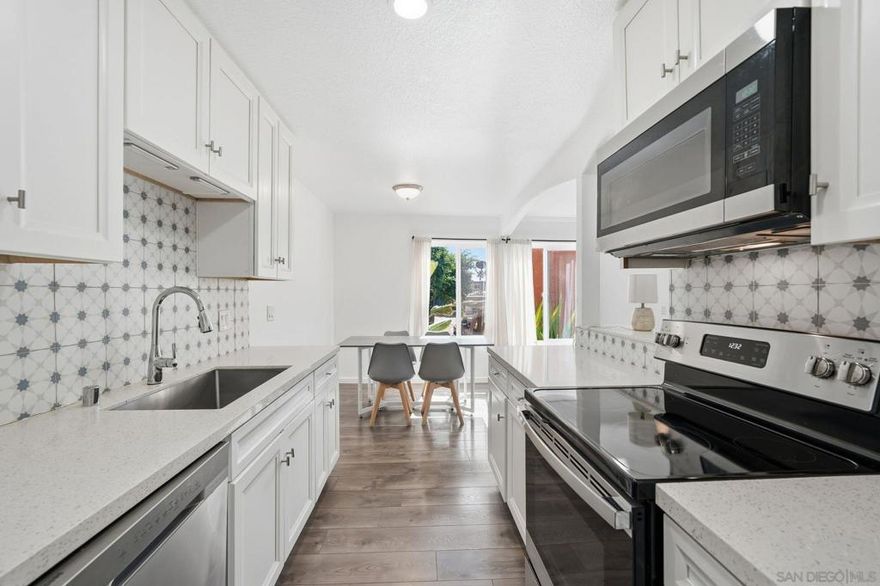 VA assumable loan at an incredible 3.250%! Welcome home to this freshly painted, upgraded end-unit located in the gated Harbor Vista community. This desirable one-bedroom, one-bath residence offers modern comfort and convenience, featuring an in-unit washer and dryer, newer kitchen appliances, recessed lighting, granite countertops, and a stylish decorative backsplash. Residents enjoy a host of community amenities, including an assigned parking space, two heated pools with spas, a picnic area, laundry facilities, and a clubhouse. HOA fees conveniently cover water, hot water, trash, security, and pool maintenance. Ideally situated just steps from Euclid Avenue’s restaurants, banks, gym, and everyday conveniences, with easy access to CA-94. Located less than 10 minutes from Downtown and Mission Valley, and just minutes from major military bases—this home offers the perfect blend of comfort, privacy, and unbeatable accessibility.