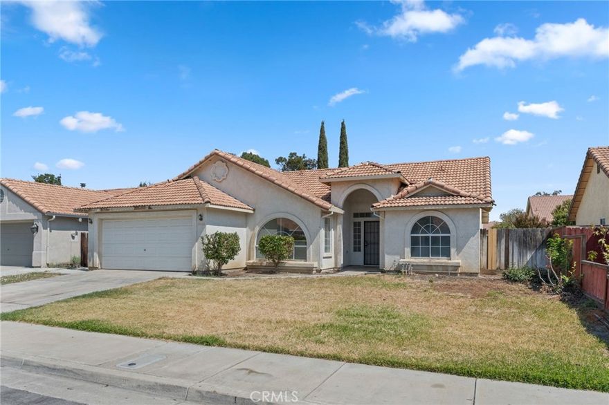 PRIME LOCATION! Charming 3 bed, 2 bath with a smart split floor plan. Enjoy a large living room with vaulted ceilings, a cozy fireplace, and a slider to the spacious backyard--ready for your landscaping vision. The kitchen is functional and well-placed with a countertop breakfast bar. Private primary suite features a soaking tub, separate shower, dual vanities, and an oversized walk-in closet. Two additional bedrooms and a roomy hall bath sit on the opposite side of the home. Great neighborhood close to shopping, parks, restaurants, and schools. Schedule your showing today!