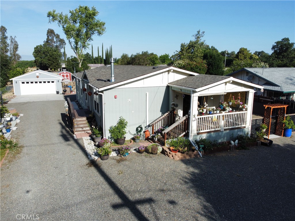 Ideal location close to Mill Creek and the Sacramento River , but not in a flood zone. No Flood insurance required. The home is in NEW condition. Detached 2 car garage and new 10' x 12' shed for extra storage. Large well house upfront 8' x 10' for even more storage. Low homeowner insurance is currently $1000 per year. The property is fully fenced and gated. The front porch is covered and faces east for early morning sun but totally protected from the hot late day sun. Inside the home we see 2"x 6" construction for more insulation than most homes. Coffered ceilings in the living room and master suite, with a gas fireplace in the living room and a Vermont Casting gas fireplace in the master suite. Pergo flooring throughout the home and Corian Counters in Kitchen, island, and both bathrooms. A good sized kitchen and living area. Centrally heated and cooled with additional minisplits in the master and one additional bedrooms. Home is built to be energy efficient ( ENERGY STAR CERTIFIED). Side porch has a powered retractable awning. Lot's parking space with a RV septic hook up / water hose /electricity available. A very nice covered concrete patio is on the side of the property also. Turn key home, An Absolutely MUST SEE. Bare lot when the home was built onto the property so, the well , septic and everything else is like new also and in perfect working condition. Foundation is permanent 433A. FHA VA USDA eligible