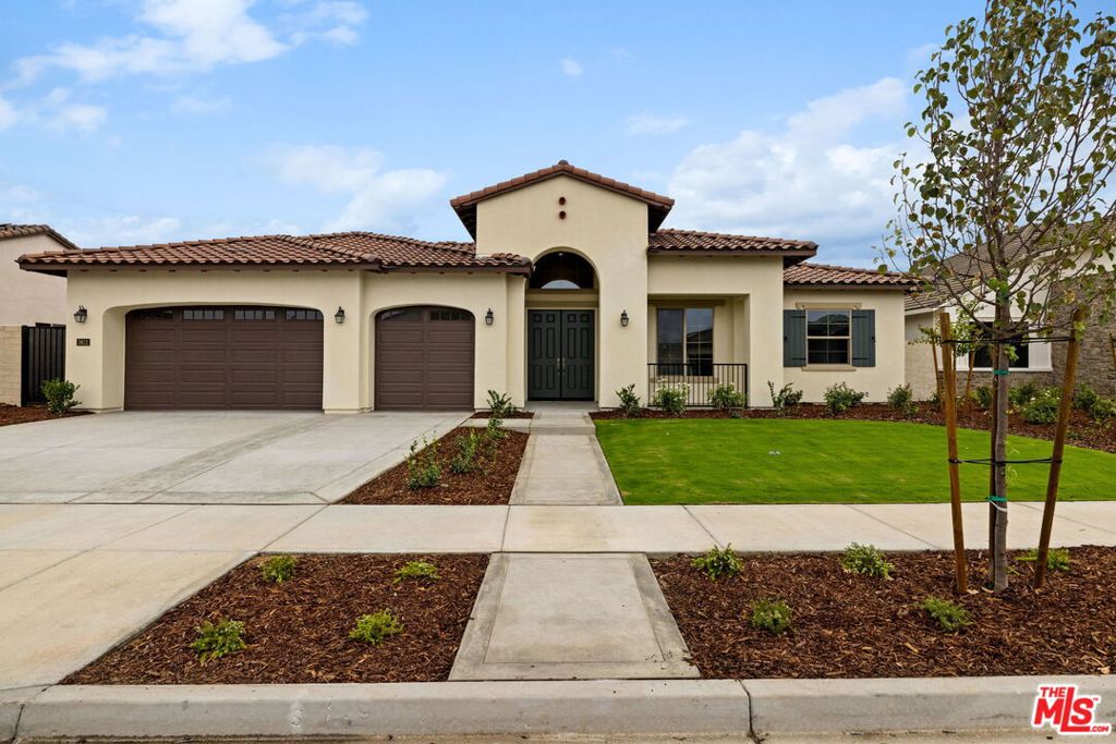 Stunning 2,737 sq. ft. Spanish elevation home on an 11,982 sq. ft. non-gated cul-de-sac lot. Features 4 bedrooms, 3.5 baths, indoor & outdoor fireplaces, and a French door from the primary suite to the outdoor living. The chef's kitchen showcases KitchenAid appliances that include a 6-burner cooktop, microwave, dishwasher, a pot filler, upgraded quartz countertops, designer backsplash, and beautiful maple cabinets in coffee stain with clear glass doors at some of the cabinets & stylish pulls. Luxury vinyl plank flooring flows throughout with upgraded tile in baths and upgraded carpet in secondary bedrooms. Move-in ready with elegant finishes and spacious design in beautiful Belcourt Seven Oaks