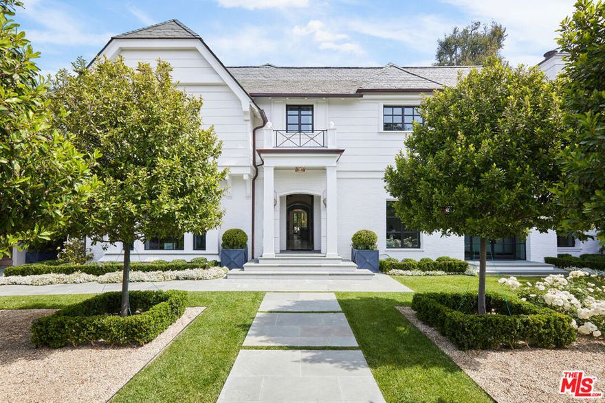 This brand-new 11,106 SF estate on just under 2/3 flat & private acre was custom built to the highest standards over 5 years for its owner, but never occupied due to relocation. It embodies historical prestige & modern sophistication on the finest street in Beverly Hills. The stunning white brick estate is flawlessly updated to include all the latest & greatest refinements. Behind gates and an exquisite courtyard, voluminous, sun-splashed living spaces offer the ultimate indoor-outdoor living. Floor-to-ceiling windows open to 6 well-landscaped terraces featuring an expansive pool/spa, 2 fireplaces & a fire pit w/ spectacular canyon views. Extensive rear lawns & entertaining areas can host 100s of guests. Beautiful chefs kitchen w/ a greenhouse breakfast room & a lacquered bar cater to adjoining family room that opens on to a pergola-covered outdoor living room draped w/ cascading vines. Spectacular primary suite w/ 12-ft ceilings & fireplace features 2 terraces, polished mahogany bar, office, magnificent dual bathrooms, indoor & outdoor soaking tubs & dressing rooms with over 90 linear feet of closet space. Additional amenities: a home theater, Pilates studio/gym, office, standalone pool house, separate guest apartment, Crestron automation & 5 en-suite guestrooms. The pinnacle of architectural excellence, style, & entertainment possibilities.
