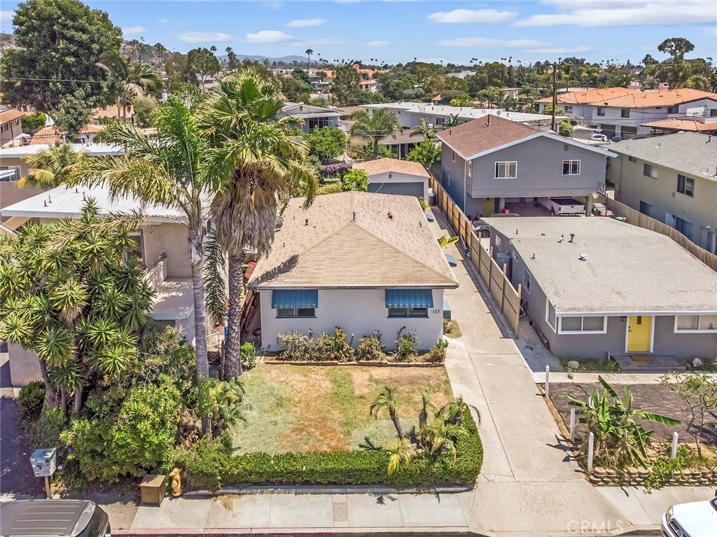 Remodeled Beach Duplex on large lot, a block and a half to the Beach! Front unit of duplex with peek a boo ocean view from front living room! Kitchen and bathroom fully remodeled in 2023 with new appliances countertops, tub/shower, cabinets, etc. Refinished hardwood oak floors and tile flooring throughout. Oversized detached two-car Garage with Storage Space and shelves shared with back unit. Walk to Downtown for shopping/ restaurants and walk to the Beach in minutes. Inside Laundry room with washer and dryer, Separate meters for gas and electric. Upgraded electrical panel. Mature landscaping with lawn. Sorry no pets or smoking allowed.