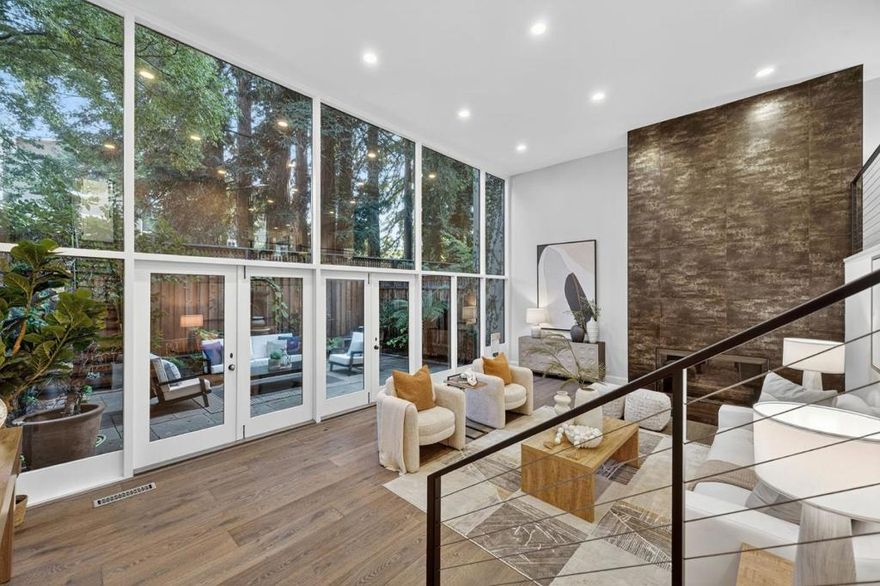 Welcome home to this impressive single family home nestled in Menlo Park neighboring Atherton! A generous open floor plan offers a perfect blend of comfort & functionality w/ soaring ceilings w/ floor to ceiling windows & doors that overlook lush redwood trees that create a sense of indoor/outdoor living. The heart of the home is a very spacious & well-appointed chefs kitchen complimented w/ stainless steel appliances w/ a 6-burner gas stove, built-in oven, wine cooler, tons of custom cabinetry, & quartz countertops w/ a breakfast bar that seamlessly integrates w/ the family room. Updated bathrooms, imported fixtures & tiles, engineered hardwood floors, double pane windows, custom railings w/ stainless steel cable railings, custom skylights, built-in speakers, central air conditioning, storage galore, a 2 car side-by-side garage, & even a community pool w/ a spacious grass area. Located within a highly desirable school district, Stanford Shopping Center, Santa Cruz Avenue, Caltrain, beautiful parks, & an abundance of stores & eateries. This one is not to miss!
