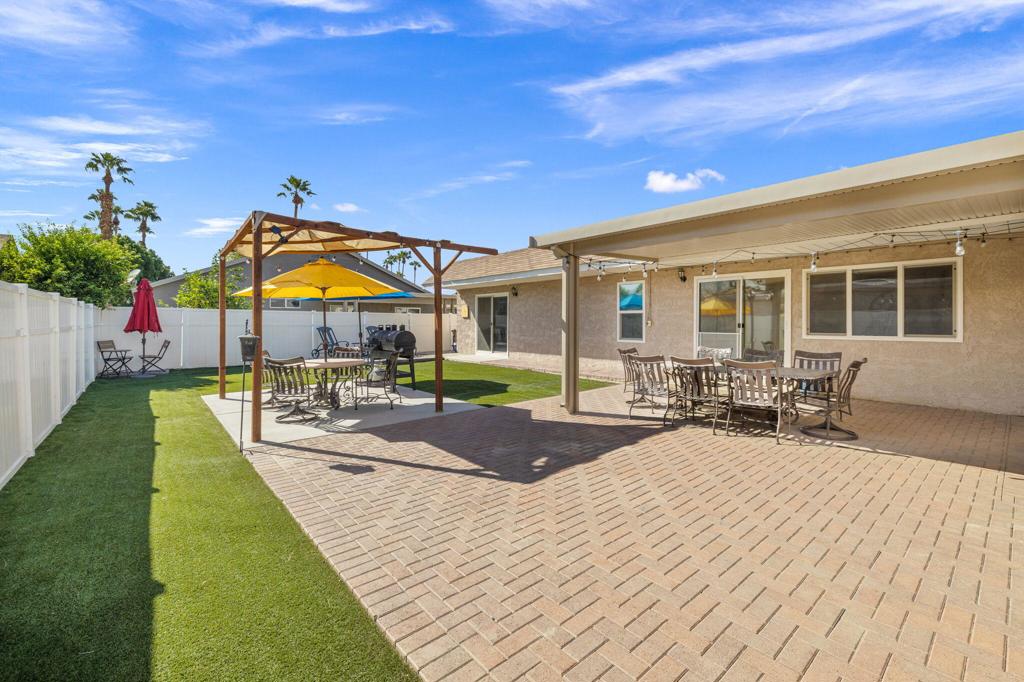 Stylish Desert Oasis with Modern Upgrades & Exceptional Outdoor Living!Discover the perfect blend of comfort, style, and functionality in this beautifully updated 2-bedroom, 2-bath home nestled in the heart of Sunnyside Estates. Move-in ready and thoughtfully designed, this charming desert retreat welcomes you with a bright, open-concept layout featuring luxury vinyl plank flooring, a soothing neutral palette, and seamless indoor-outdoor flow.The remodeled kitchen is a chef's delight, showcasing granite countertops, a spacious island with bar seating, sleek cabinetry, stainless steel appliances, and premium finishes. The primary suite offers direct access to the backyard through sliding glass doors--ideal for enjoying morning coffee or peaceful sunset views. Both bedrooms offer ample space and natural light, and the bathrooms are tastefully appointed with modern touches. Step outside to your private backyard oasis, complete with a large covered patio, low-maintenance artificial turf, and multiple seating areas perfect for entertaining guests or relaxing under the desert sky.Pet lovers will appreciate the custom dog run featuring a shaded area and direct access to the home--comfort and convenience for your furry companions.Located within the gated Sunnyside Estates community, residents enjoy a low HOA and access to top-tier amenities including a sparkling pool and spa, clubhouse, pickleball, tennis and basketball courts, and scenic picnic areas. Just minutes from the iconic Empire Polo Club--home to Coachella and Stagecoach--and surrounded by endless shopping, dining, and entertainment options.This delightful home offers an easygoing, low-maintenance lifestyle with all the perks of desert living. Don't miss your chance to own a stylish sanctuary in one of the area's most desirable communities.