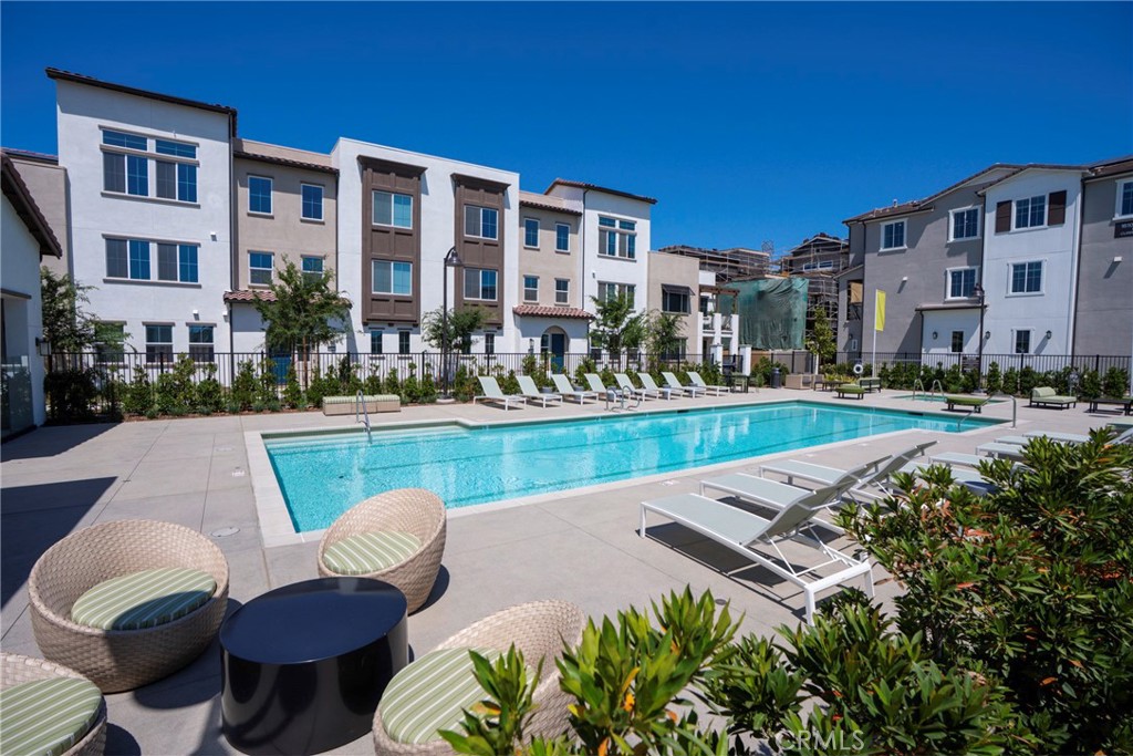 This spacious and versatile condo features a large covered deck off the main living area, a welcoming front patio lounge, and a 2-car attached garage. Additional highlights include built-in solar for energy efficiency and lower utility costs. Located in the desirable Sage Court community at The Preserve, just steps from the newly completed pool and clubhouse, and near the vibrant Preserve Town Center. Enjoy convenient access to the 71, 91, 15, and 60 freeways, with parks, trails, shopping, and dining all within walking distance.