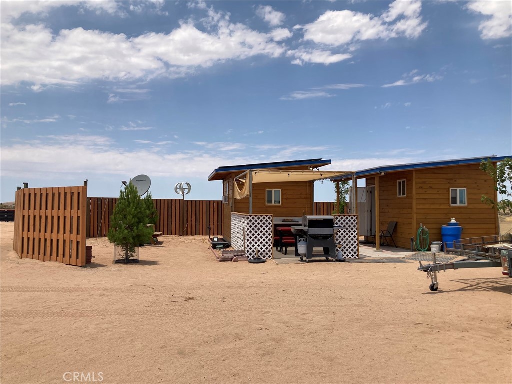 Don't miss this wonderful opportunity in Hinkley. There are approximately 70 pistachio trees & 30 pomegranate trees with drip system on this 40 acre property. You can even spend the night (or nights) on the property as there are 2 super cute little cottages, both with heating/cooling, solar Power & back up batteries. All built with quality products, super insulation & cedar paneling. Nice & cool even when it is more than 100 degrees outside. Very nice patio area between & around the cottages. One is studio type with sleeping, TV watching area. The other has a kitchen and bathroom that can be shared by the other little cottages that are planned. Two more foundations have been constructed for future cottages. There is a large graded staging area for tractor trailers to park. And an outdoor bathroom with toilet for when you're working outside. This property has been assigned an address and a mail box is in place so that mail and packages can be delivered. This property is not far from the future BNSF Railroad Distribution center. which is expected to be the largest in the United States. The $1.5 billion project will span over 4,800 acres between Lenwood and Hinkley, creating the first fully integrated rail yard, intermodal facility, and logistics park in the United States. This HUGE project is expected to bring 20,000 jobs to the area and thousands of new homes will be needed. The Owner of this property has already been in touch with the San Bernardino County Planning Department & was told that it could be split into approximately fifty .63 acre lots. Percolation test has been completed & approved for a septic system The property already has electric service & there are electric poles on two sides of the property. It has a well, 240' deep, installed in November of 2024. which produces 10 gallons per minute of good quality water. There is one 5000 gallon water tank and two 2500 gallon tanks. There is a large 9x12 pump house with Solar System & 2 smaller pump houses with solar. And if you're considering growing some veggies then you will love the giant green house that is currently on the property. Per County it can stay as long as the ends are removed. The property is completely fenced with special fencing that extends about 6' below the ground level then turns outward 90 degrees to keep rabbits, dogs and other critters out. Vehicle entry is easy through any of the four 12 ft gates. Gas & Spectrum service run along Hwy 58.