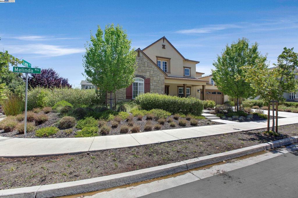 Improved Price! Stunning Rose Estate home only 5yrs old offering spacious living space on premium end corner lot. Designed for everyday comfort & stylish entertaining, this home blends modern elegance with high-end functionality. Main level features a luxurious primary suite, a soaking tub, rain shower, dual vanities & oversized walk-in closet. A second en-suite bedrm & a dedicated office with 20' vaulted ceilings provide ideal space for guests or remote work.The expansive great room showcases engineered wood floors, a gas fireplace & built-in speakers. The gourmet kitchen includes a Sub-Zero refrigerator, Wolf 48” gas range, double ovens, solid counters, an oversized island & spacious walkin pantry. A convenient drop zone & large laundry room with built-ins & sink complete the main floor. Upstairs offers 2 bedrms, 2 full baths, a spacious family/media rm pre-wired for TV & flexible gym or hobby space. Seller spent $250K on custom designed backyard for year-round enjoyment. A tiled California Room with built-in speakers & heater, fully equipped outdoor kitchen with Fire Magic grill & power burner, pergola, built-in spa & fountain, firepit, lighting, pavers & irrigation system. More upgrades include own solar panels, 3 zone HVAC, & EV outlet. Open Sat/Sun 8/2 & 8/3 1:30-4:30
