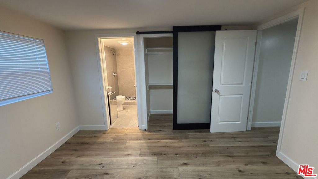 This just renovated studio apartment offers the privacy and layout of a one-bedroom. The sleeping area is separated from the kitchen by a wall and a door that closes, creating a more distinct living space. The bathroom features a spacious shower and a mirrored medicine cabinet (not shown in photos). Inside the unit, you'll find luxury vinyl flooring, new windows, fresh drywall and paint, brand-new cabinetry, and a gas oven range with 5 burners, including a griddle. A mini-split AC system provides efficient cooling. One dedicated parking space is included. Please note there is no laundry on site. However, 4th Street Laundry is conveniently located less than 100 yards away. To express interest, please submit your application through Zillow or Rent Spree. Showings will be scheduled with pre-qualified applicants. All showings will be organized by the listing agent only. Tenant to confirm square footage. Downstairs unit.