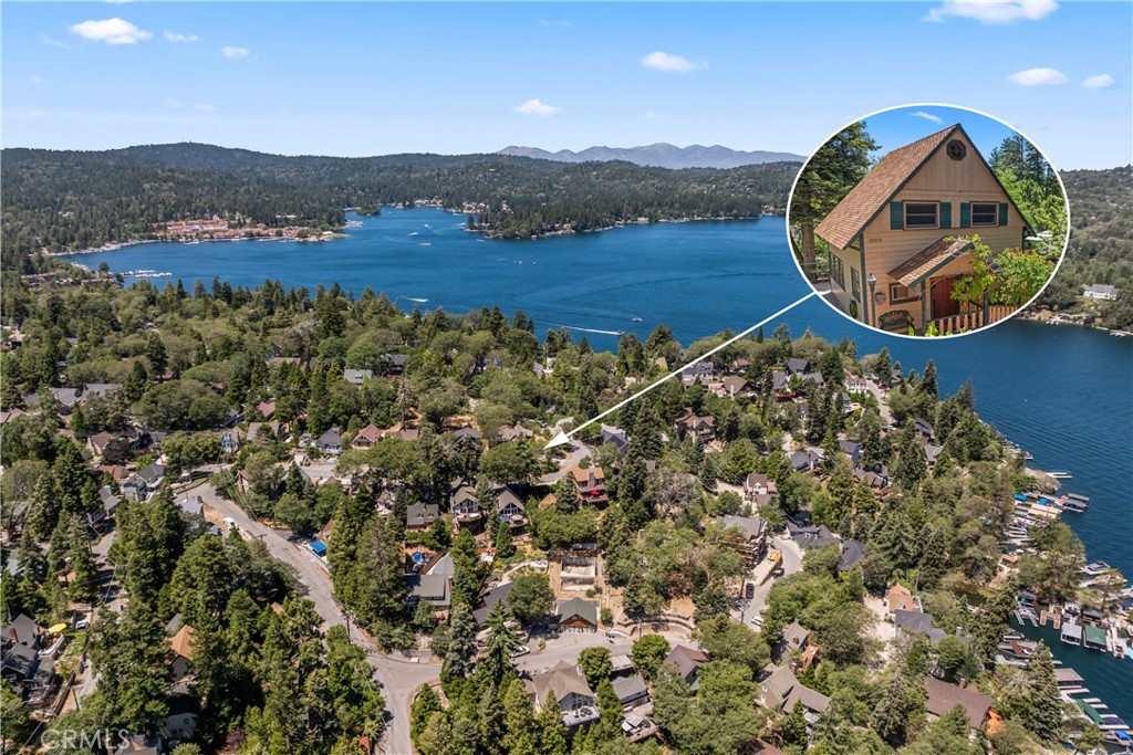 This cozy Lakeview cabin has A Main House With 3 Bedrooms A Loft +A Full Bath. The Kitchen Has Original Cabinets & Hardware. The Living room is Wrapped in Original Wood Windows - The Downstairs Suite can be accessed outside or through The Kitchen and has a Bedroom/ Living Area, kitchenette, bath, laundry area, and Lakeview deck! Three outdoor areas, Fire Pit Patio , Hot Tub, Patio & Deck . This Wisteria Cottage was built in 1948