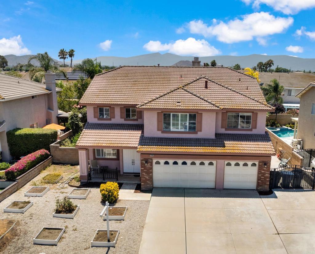 Beautiful 5 bedroom, 3 bath upgraded home – located in sought after Cloverdale Farms in central Eastvale. Walking up to the home you are greeted with garden boxes in the front. As the front door opens, the home welcomes you with its living and dining room. The kitchen, family room, fireplace and downstairs office flow into a 400 sq ft closed in entertainment patio taking you to the back yard. The kitchen includes stainless appliances, granite countertops, a kitchen island, and beautiful cabinetry. The downstairs also includes a bedroom, bathroom and laundry room. Follow the staircase up to an additional family/game room, with aquarium wall separating a second office/bonus room. The impressive master bedroom includes a private sitting area with fireplace, expansive space and a walk-in closet. The second story has 3 more generously sized bedrooms and a shared bathroom. Walking through the home reveals elegant tile flooring, plantation shutters, crown molding throughout, intercom system and ceiling speakers. The backyard is an entertainer's dream complete with a rock waterfall pool, BBQ island, fire pit and garden boxes! RV parking, three-car garage and ample storage complete this home. See Supplemental.