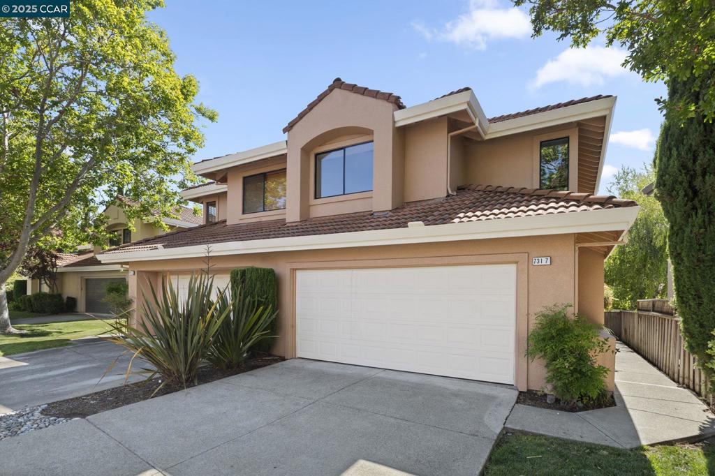 This remodeled unit feels just like a single-family home, featuring an end unit with a large private backyard. It boasts all-new interior paint and flooring. The main level includes a spacious, updated kitchen, a modernized half bath, a generous living room with floor-to-ceiling windows, a cozy fireplace, and a dining area. Upstairs, you'll find the primary suite with a beautifully updated bathroom, two additional bedrooms, and a refreshed secondary bathroom. The updated laundry room is conveniently located on the second floor. Just a short walk to the community pool and spa. Open Saturday and Sunday from 1.00 to 4.00.