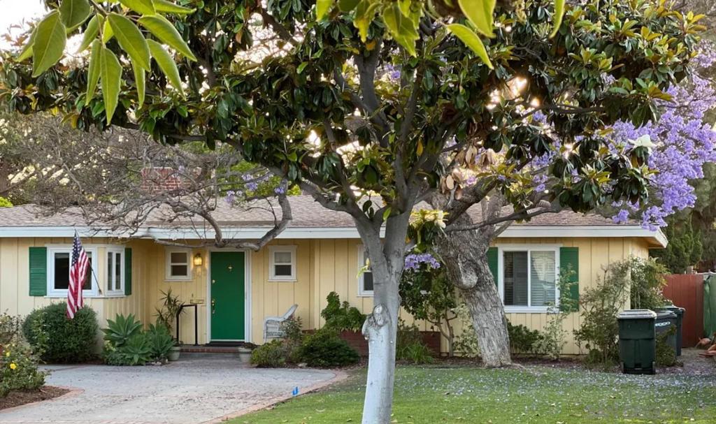 This beautifully appointed home in the Country Club area of Coronado is available for rent starting November 1, 2025 and offers both long-term and short-term options, furnished or unfurnished. Situated on a large lot, it features ample parking, a spacious, park-like yard, and is just a short bike ride to the beach or town. Inside, you'll enjoy an open, airy atmosphere with refinished hardwood floors throughout, new carpeting in the primary bedroom and AC! The fully stocked kitchen opens to a cozy family room with a large flat-screen TV. The large primary bedroom has a king-size bed, a walk-in closet, a sitting area, French doors that open to the beautifully landscaped backyard, and an en suite bathroom with a large shower and custom cabinetry. The second bedroom has a queen-size bed and en suite bathroom with a tub and shower, while the third bedroom includes a full-size bed. There's also a dedicated office space and a laundry closet with a full-size washer and dryer. This charming home is perfect for those looking to relax and enjoy the best of Coronado living. Rates vary depending upon the length of stay. The home sleeps 6 people comfortably. Garage accommodates 1 car or small SUV November 2025 thru May 2026 - $11,500/month June/August $18,000/mth July/$25,000/mth
