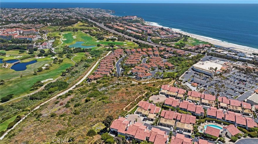 Located in the prestigious enclave of Monarch Beach within the secluded gated community of Monarch Bay Villas, this remarkable ocean-view end-unit villa has recently undergone an extensive and meticulous renovation from top to bottom including new PEX piping, sliding glass doors, new duct & heating system, water heater, recessed lighting, new air conditioner, top of the line whole house water filtration system, Insta Hot water system, new kitchen, new baths, wide plank flooring, custom closets throughout, custom window coverings throughout, new decks, fencing, hard and soft scape, landscaping, irrigation, new fencing and much more.  The spacious living room serves as a captivating focal point with its lofty wood-beamed ceilings, inviting fireplace, and, notably, the allure of the large private balcony offering refreshing ocean and golf course views. The expansive gourmet kitchen showcases elegant custom cabinetry, quartz countertops, a large island at its center, and top-of-the-line built-in appliances, including a 42" refrigerator, dishwasher, gas range & oven, disposal and trash compactor.  Just off the kitchen, enjoy some downtime in the family room or embrace the indoor-outdoor lifestyle on the well-appointed private patio awaiting you with hard and soft scaping and private hot tub. Upstairs, the primary suite offers a private ocean view balcony.  The home boasts white water views of Salt Creek Beach as well as Catalina Island to the Dana Point headlands, the iconic Monarch Beach Golf Links the oceanfront golf course designed by premier golf course architect Robert Trent Jones Jr., majestic landscapes of two world-class luxury resorts—the Ritz Carlton and the Waldorf Astoria.  An oversized 2 car garage has built in storage cabinets and a large separate storage closet and an EV charger.  The Monarch Bay Villas community provides direct trail access to the Salt Creek Trail, Waldorf Astoria, a variety of restaurants, cafes, salons, fitness facilities, and shopping destinations at the nearby Monarch Bay Plaza. All residences within Monarch Bay Villas received a new clay tile roof and freshly painted exteriors in 2022. Whether you seek a primary residence or an enchanting vacation retreat, this extraordinary opportunity invites you to own your slice of coastal paradise in the hidden gem of Monarch Bay Villas.  Community amenities include a private pool, spa, clubhouse, billiards room, fitness room, dry sauna, restrooms, open green spaces and barbecue area.