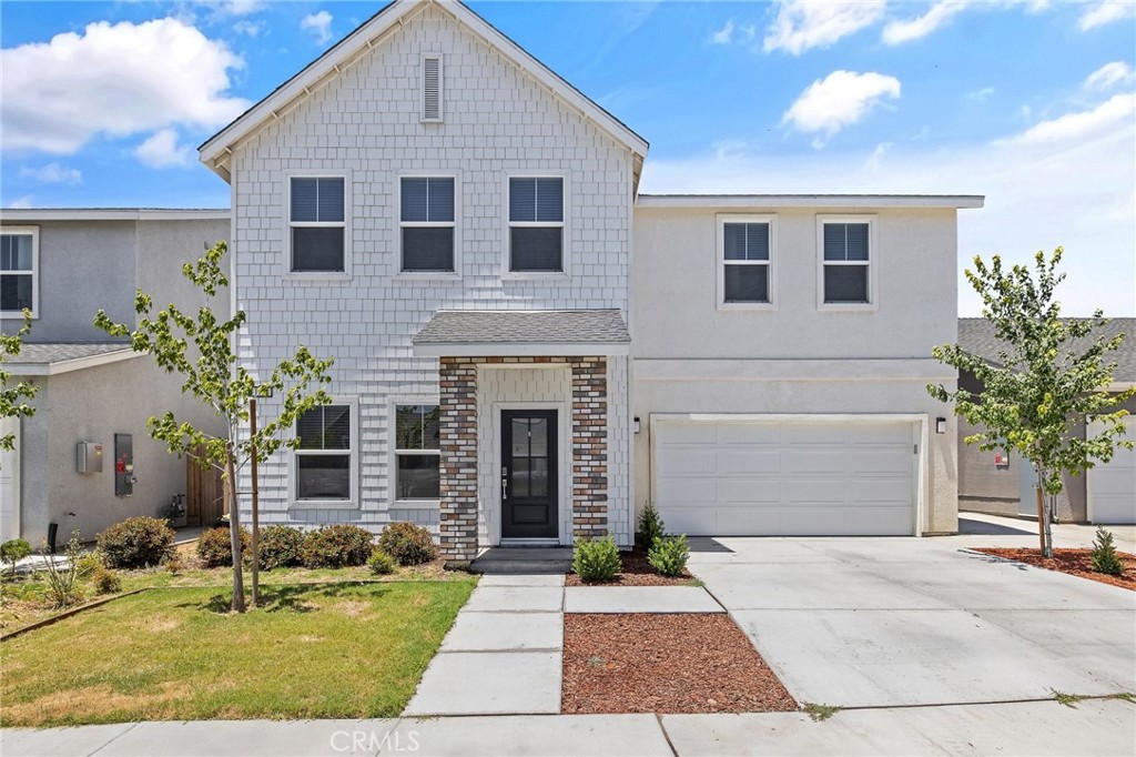 Welcome to this beautifully upgraded two-story home in NW Hanford, offering 5 spacious bedrooms and 3.5 bathrooms, including a guest suite with its own private bath conveniently located on the main floor. Enjoy an open-concept layout and modern touches throughout. The kitchen features Samsung smart refrigerator, stainless steel appliances, which will remain with the home. Additional highlights include zero blackout blinds, smart exterior lighting controlled via app, and a low-maintenance backyard with pet turf. The garage is EV-ready with hookups, and solar (owned) is included for energy efficiency. Bonus: Gym equipment can be included with the sale! Walking distance from Frontier Elementary School.