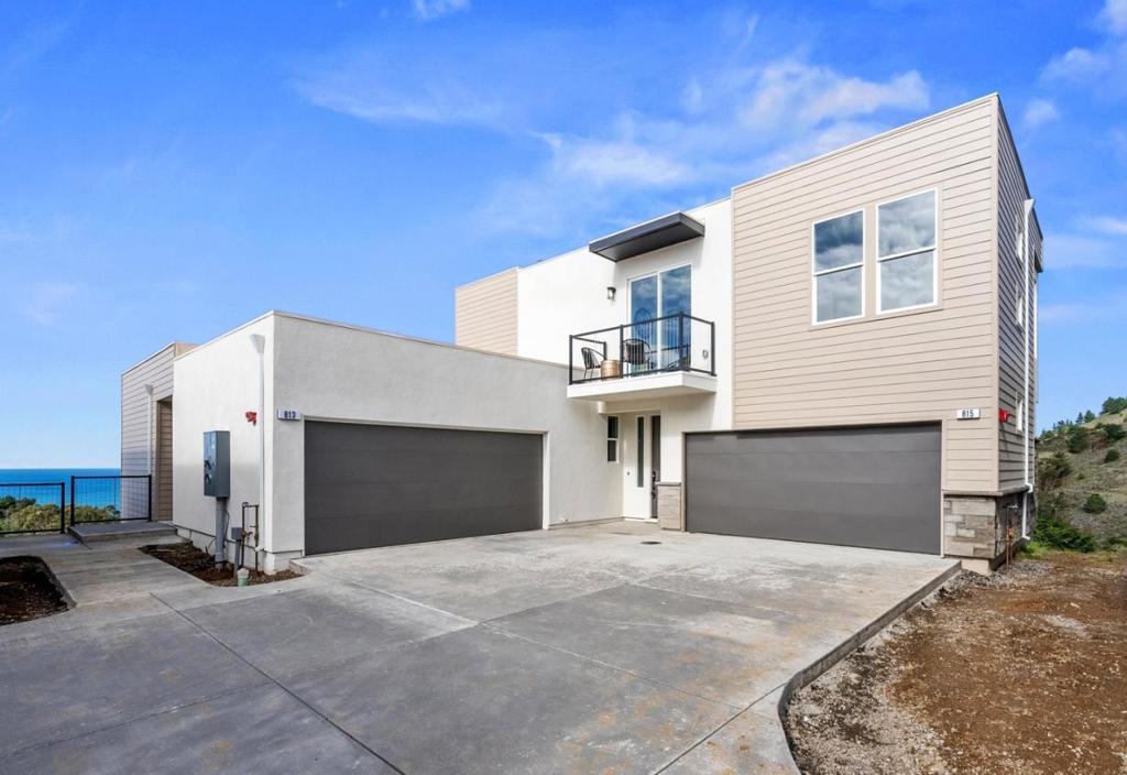 MOVE IN READY!!! Welcome to Pacifica Heights - Where Luxury meets Serenity! Each residence has been meticulously designed with modern architecture, spacious layouts, and energy-efficient features, ensuring a comfortable and environmentally responsible lifestyle. 811 Fassler: Highlighted by an open kitchen with large island and pantry area. The kitchen opens and flows seamlessly into the great room, providing flexibility to arrange your living and dining areas. An additional powder room on the main level is perfect for guests. Luxurious primary bedroom with sliding door to a private patio area and en-suite bath with a large walk-in closet. Primary bathroom featuring double vanities, freestanding tub, and separate shower. Second bedroom downstairs with en-suite bath and private patio. Additional features include in-unit laundry and attached two car garage. Prepare to be captivated by the awe-inspiring beauty of the Pacific Coastline. Residents at Pacifica Heights are treated to breathtaking ocean and canyon views. You'll wake up to the serenity of the coast and spend evenings on your private patio, savoring the coastal breeze. This is now Pacifica's finest address!