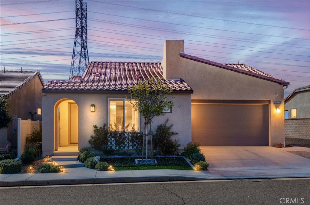 Welcome to this beautifully upgraded single-story home located in the highly sought-after Altis 55+ Active Adult Community. Featuring 2 bedrooms, 2 bathrooms, and a versatile office/den, this home offers the perfect blend of comfort, style, and functionality.
Enjoy PAID OFF SOLAR and over $50,000 in upgrades throughout! The open-concept floor plan showcases upgraded flooring, quartz countertops, and custom upgraded kitchen cabinets. The gourmet kitchen also includes a large island, stainless steel appliances, and ample storage—ideal for both cooking and entertaining.
Additional features include canned lighting, faux wood blinds, security cameras, generator hook-up, and gas/electric dryer connections. The primary suite offers a spacious layout with a walk-in closet and a beautifully upgraded en-suite bathroom.
Step outside to a low-maintenance front and rear yard with water-conserving landscaping, perfect for relaxing or enjoying the peaceful surroundings.
This move-in-ready home combines modern upgrades, energy efficiency, and effortless single-level living—all in a friendly, active community with incredible amenities nearby.