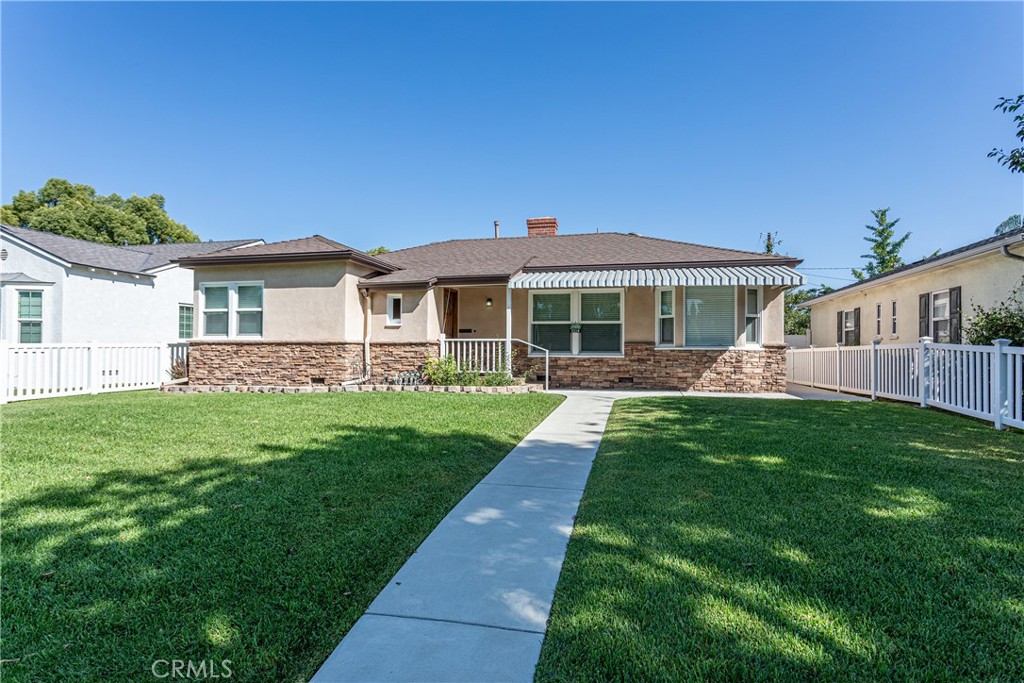 Pride of ownership shines throughout this beautifully maintained 3-bedroom, 2-bathroom home located in the heart of Burbank. From the moment you arrive, you'll notice the care and attention given to every detail. Inside, warm wood laminate floors and a classic Stacked Stone fireplace create a welcoming atmosphere, while the well-appointed kitchen features custom-quality cabinets, stunning quartz countertops, recessed lighting, and sleek Frigidaire appliances. The kitchen opens to a one-of-a-kind breakfast nook with vintage aquamarine diner-style seating, equal parts charm and comfort.
The home’s layout is both functional and inviting, with a thoughtfully designed walk-through bathroom and energy-efficient tankless water heater. Recent upgrades include a complete remodel of the electrical, plumbing, roof, windows, bathrooms, and kitchen, all of which were completed within the last 3-6 years. The floors have been updated throughout, adding to the home's modern feel.
The property also includes a detached garage and a separate bonus structure, offering excellent potential for a home studio, office, or possible ADU, buyers to verify with the city. Additionally, great concrete walkways wrap around the home, enhancing its curb appeal and providing convenient access to all areas. The home also features an aluminum-covered patio, perfect for outdoor relaxation and entertainment.
Set on a quiet residential street, this gem is ideally located near all major studios, including Disney, Warner Bros., and Nickelodeon, with easy access to Magnolia Park, local schools, shopping, dining, and freeways.
Rarely do you find a home so lovingly cared for, in such a prime Burbank location. This is the one you’ve been waiting for.