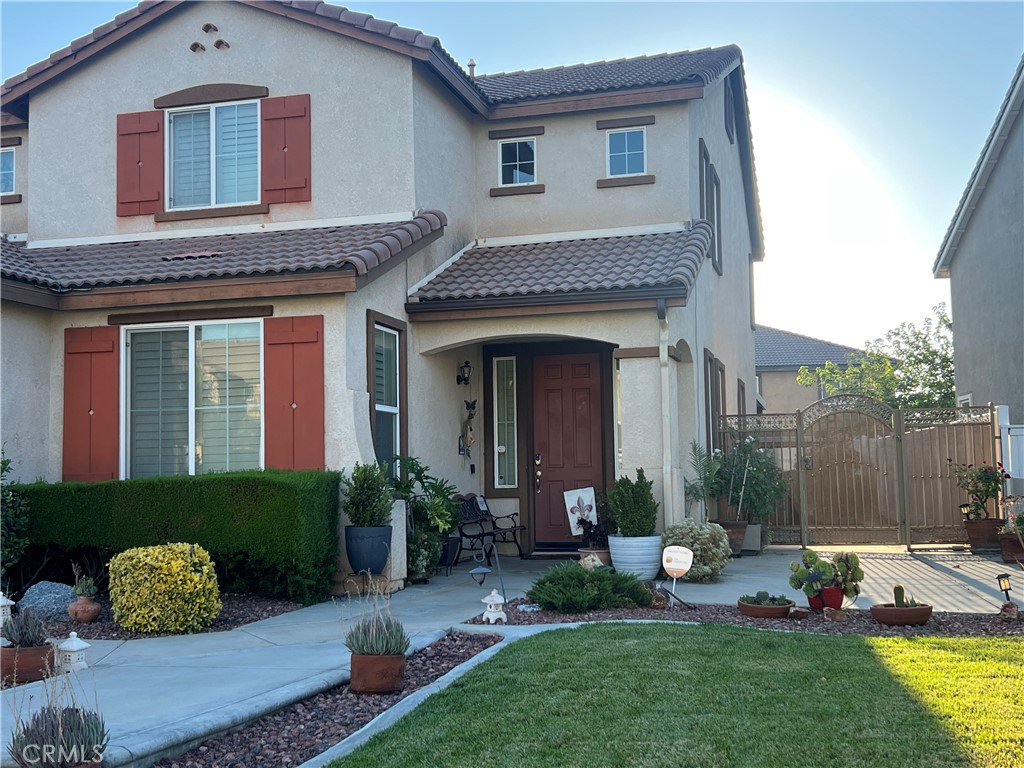 Beautiful Two Story Home located at an established neighborhood. Nestled in a cul de sac awaits the next chapter. From the moment you arrive, the house impresses with its inviting hardscape, steps to entry doors, newly painted exterior home. Step inside a high ceiling living room where gleaming bamboo hardwood floors. Adjacent to the living area is the formal dining room, ideal for holiday feasts or intimate dinners. Then to the Kitchen with granite counter tops, decorative back splash and granite island with sink. Stainless steel appliances- including double door refrigerator, gas range, microwave and whisper quiet dishwasher. Adjacent to the Kitchen is the Family room with fireplace, where you can cozy up on crisp evenings. Sliding doors to the backyard, extending your entertainment on the covered alumna patio, offers privacy and tranquility, framed by mature hedges and flowering shrubs. Windows throughout the house with Vinyl White Shutters. All interior walls newly painted making it move in ready. One bedroom downstairs for your guest/in laws and a full bathroom next to it. Upstairs, all newly installed carpets at all bedrooms. Spacious Primary Bedroom and double sinks at bathroom with stone countertop. Good size walks in closet. Backyard with wrought iron gates on both sides, vinyl fence around the house. Three car garage tandems. Storage shed at side yard included with the property. Situated close to parks, schools and local shops, the location balances tranquility and accessibility. Commuters will appreciate quick access to major highways and public transportation, while family enjoy a vibrant, friendly community.