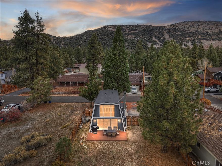 Discover the charm and potential of this classic gambrel-style home, nestled in a peaceful Big Bear City neighborhood. Flooded with natural light, this inviting residence offers a warm, open feel from the moment you step inside. The unique roofline and rustic character set the tone for a true mountain escape.

Set on a comfortable, usable lot, the property offers just the right amount of space to personalize—whether you envision creating cozy outdoor seating areas, adding simple landscaping touches, or shaping it into your ideal mountain retreat. It’s a great canvas for bringing your ideas to life without feeling overwhelming.

Perfect for those looking for a home with character, sunlight, and room to make it their own, all in one of Big Bear City’s well-loved neighborhoods.