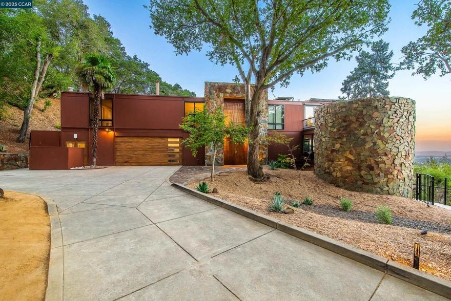 Unique mid-century modern retreat with sweeping Mt. Diablo views, walls of glass, and expansive decks for seamless indoor-outdoor living. The dramatic living room features floor-to-ceiling windows on three sides and a floating fireplace, while the dining room and chef’s kitchen also capture stunning views and open to the pool and patio. The bedroom wing includes four ensuite bedrooms all with corner windows and walk in closets. The primary retreat enjoys a loft with relaxing views, a dressing room, spa-inspired bath, and direct access to the pool, spa, and sauna. The lower level includes an office/guest suite, art studio, and gym with full baths, creating flexible spaces ideal for work, creativity, and wellness. Designed for both grand entertaining and quiet relaxation, this architectural gem sits on a gated, private lot surrounded by nature with multiple view decks, mature landscaping, and raised garden beds. Enjoy resort-style amenities year-round with pool parties, sunset dinners, and morning yoga on the deck...all just minutes from vibrant downtown Lafayette, Walnut Creek, BART, and top-rated Lafayette schools!