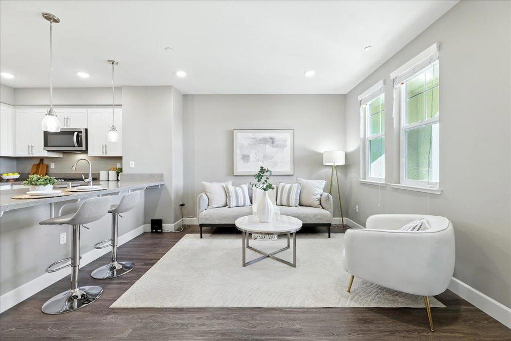 This stylish 2-bedroom, 2-bathroom home, just 8 years old, combines modern design with exceptional convenience in the sought-after North San Jose neighborhood. The open kitchen features a chic white and gray color scheme, complete with a spacious island that serves as both a focal point and a practical workspace. Its sleek design and contemporary finishes create a light and airy atmosphere, perfect for both cooking and entertaining. Situated just minutes from BART, Safeway, CVS, banks, and a variety of restaurants, this home offers ultimate convenience for busy professionals and families alike. The property faces Mercado Park, offering peaceful views from the living room window. The park also features a kid's playground, making it ideal for families with young children or anyone who enjoys outdoor spaces. Whether you're commuting, running errands, or enjoying the tranquil park views, this home delivers both comfort and practicality in a prime North San Jose location. Perfect for those looking for a modern lifestyle in an unbeatable neighborhood.
