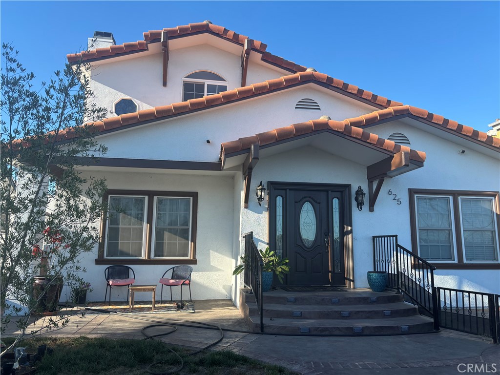 Welcome to a fantastic opportunity in Carson. This property offers a versatile layout perfect for large families. The main floor has one master bedroom, an en-suite bathroom, two additional bedrooms, one full bathroom, and a 1/2-bathroom, a formal entry, a living room, a kitchen, and a separate dining room. You can escape to an upstairs master bedroom suite with an en-suite bathroom. This clever layout is ideal for multi-generational living. The kitchen has many bells and whistles. The kitchen has a stainless-steel sink, new quartz counters, a new stainless steel 8-burner 2-oven stove, new cabinets, and a new dishwasher. Front yard fencing, new front entrance, and new front door. New window screens. New flooring in all bedrooms. Upgraded gas fireplace. The property also has a newer AC unit installed. Location is everything, and this home offers incredible convenience. The property is just minutes away from The Home Depot and grocery shopping. Easy access to the 110 and the 405 freeways. It is near lots of restaurants and just 15 minutes away from Cabrillo Beach and the Port of Los Angeles.