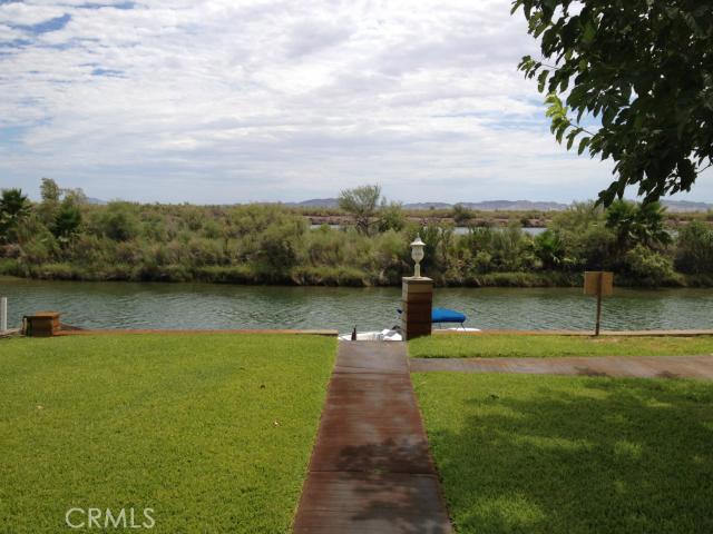 ***...RIVER FRONT WITH DOCK! *** No Doubt this will sell FAST! Relax on your covered front deck with picturesque views up and down the river while overlooking your boat tied to your DOCK right in front of your house. Remodeled Kitchen with GRANITE counters and STAINLESS STEEL appliances it doesn't get much better than that! This River House has wood floors, 3 Bedrooms, 2 Baths and plenty of shade trees. A large 2-car garage for all the toys and lots of additional parking on the 1/4 acre RIVER FRONT lot. Enjoy fishing, boating, jet skiing, hunting, and it's an off-road paradise for the motorcycles and ATVs.