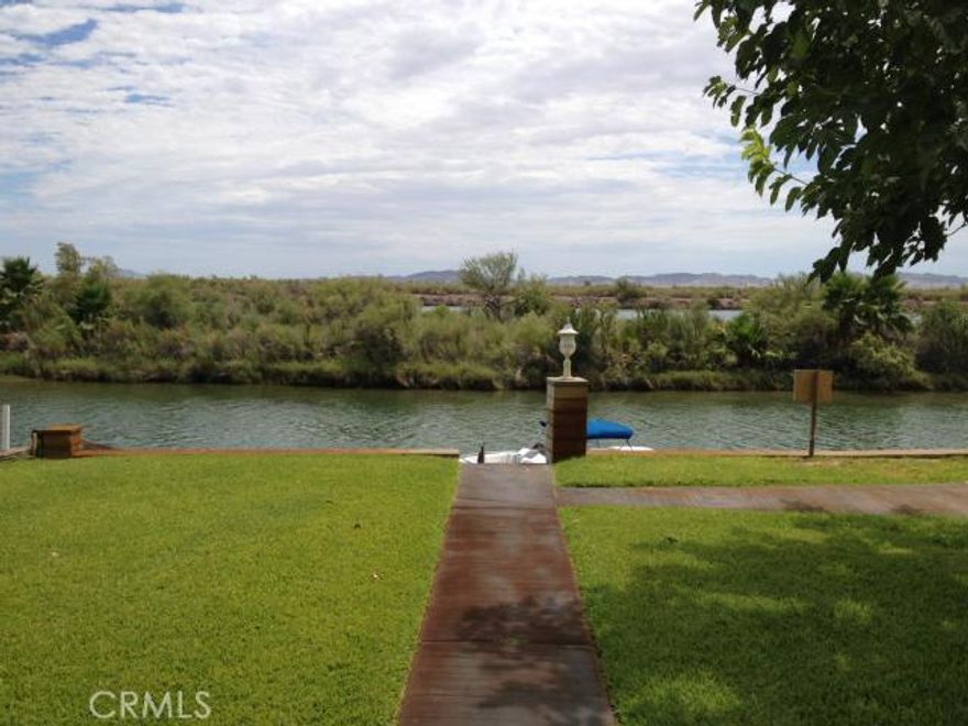 ***...RIVER FRONT WITH DOCK! *** No Doubt this will sell FAST!  Relax on your covered front deck with picturesque views up and down the river while overlooking your boat tied to your DOCK right in front of your house. Remodeled Kitchen with GRANITE counters and STAINLESS STEEL appliances it doesn't get much better than that!  This River House has wood floors, 3 Bedrooms, 2 Baths and plenty of shade trees. A large 2-car garage for all the toys and lots of additional parking on the 1/4 acre RIVER FRONT lot. Enjoy fishing, boating, jet skiing, hunting, and it's an off-road paradise for the motorcycles and ATVs.