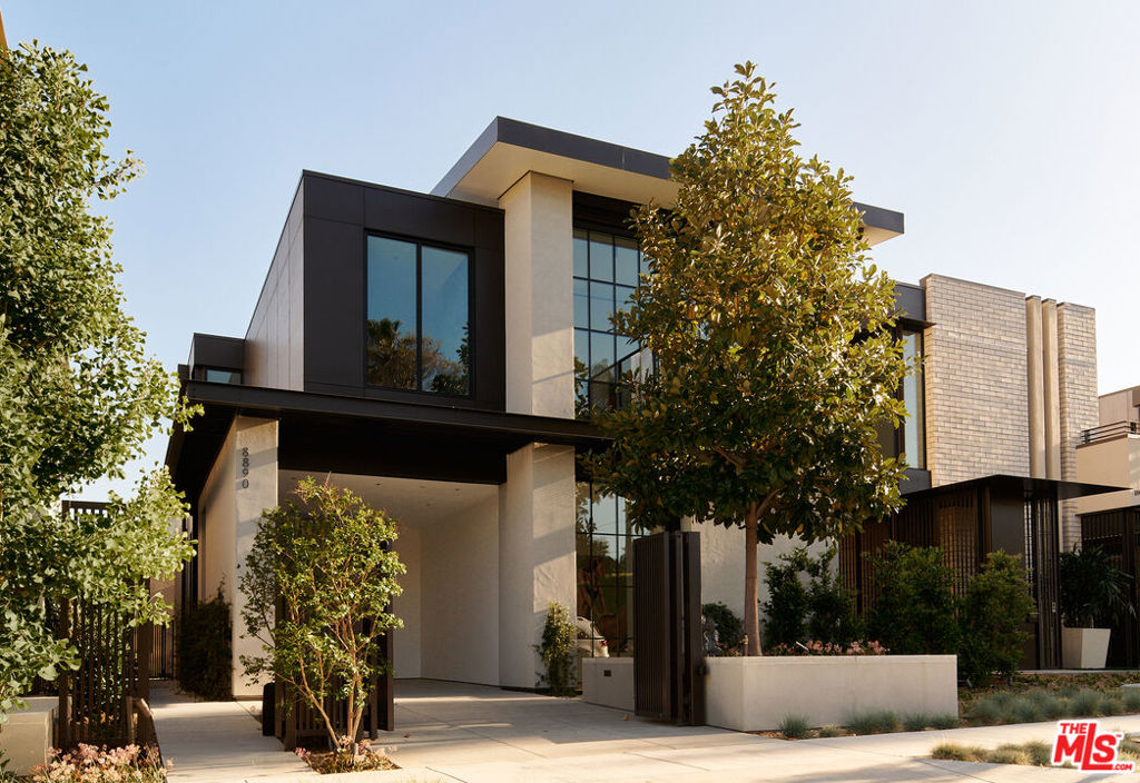 Glass House at 8899 Beverly. Olson Kundig. West Hollywood luxury presides at 8890 Rosewood Avenue where incredible resort amenities meet architectural brilliance. This exceptional home is part of a unique collection of eight signature homes crafted by the world-renowned architect Olson Kundig, each boasting a distinctive material palette and a one-of-a-kind living experience. Glass House is a stunning home with unparalleled features that epitomize comfort and understated opulence. This three-bedroom, two-level masterpiece immediately makes an impression with a modern exterior featuring exposed structural steel and a curved standing-seam metal roof, complemented by a painted metal trellis wrapping from the front to the side entry. True to its name, Glass House makes use of extensive glazing, soaring ceiling heights, and a natural flow between the indoor and outdoor environments to create open, airy living spaces. Sophisticated yet welcoming in design, the interior boasts wood floors, Lutron HomeWorks QS System lighting, and Fleetwood glazed doors and windows. The gourmet kitchen features top-of-the-line Gaggenau and Miele appliances, dark-stained white oak cabinetry, and custom paneling. A custom stairwell with open-riser wood treads and exposed steel curates an artful transition from level to level.Upstairs, the primary suite includes a private balcony adorned with a woven-wire mesh guardrail and steel grate decking, providing a tranquil retreat to unwind and admire the views. The ensuite bathroom has full stone flooring and walls made of Danube marble. Outside, find a chaparral-inspired garden curated by Coen + Partners, a pool and spa, and a guest house. Explore the eclectic palette of crepe myrtle and cork oak trees, exuberant bougainvillea, sea lavender, and fairy crassula, creating a picturesque backdrop for outdoor gatherings. The signature collection deftly blends individuality and privacy with exceptional resort lifestyle amenities. 8899 Beverly Boulevard - Olson Kundig's "Love Letter to Los Angeles" - offers residents access to 24-hour concierge service, a state-of-the-art fitness center, and a lushly landscaped oasis with a resort-style pool, spa, a custom outdoor kitchen, and an on-site restaurant, Stella. Experience the epitome of luxury urban living in West Hollywood. Contact us for a private viewing today.