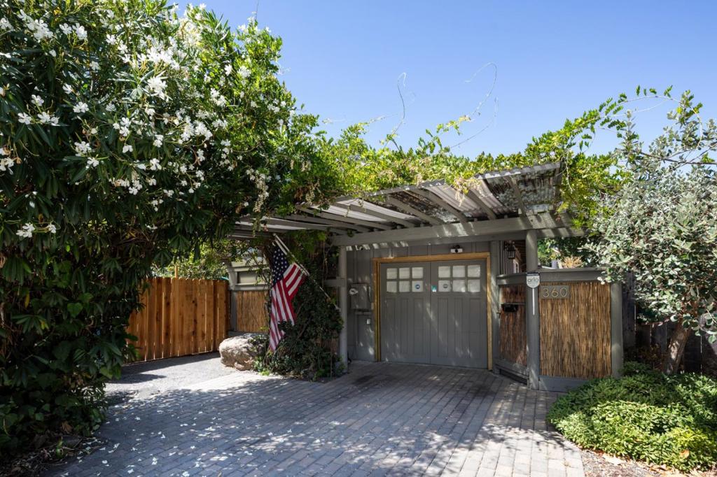 Tucked behind lush greenery lies a hidden gem in Palo Alto's Ventura neighborhood--a serene and understated home exuding quiet elegance. This 2-bedroom, 1.5-bath retreat offers abundant natural light and effortless, low-maintenance living. Light flooring and cabinetry, leather-finished granite countertops, and stainless steel appliances create a harmonious blend of style and tranquility. A detached bonus structure in the backyard provides versatile space for an office, studio, or creative retreat. Decorative reed fencing adds to the homes appeal. There is also a one car attached garage. With newly renovated Boulware Park just next door, minutes to shopping, midtown and downtown Palo Alto this home is a rare find offering both peace and convenience. (please note 1/2 bath was added without benefit of permit).