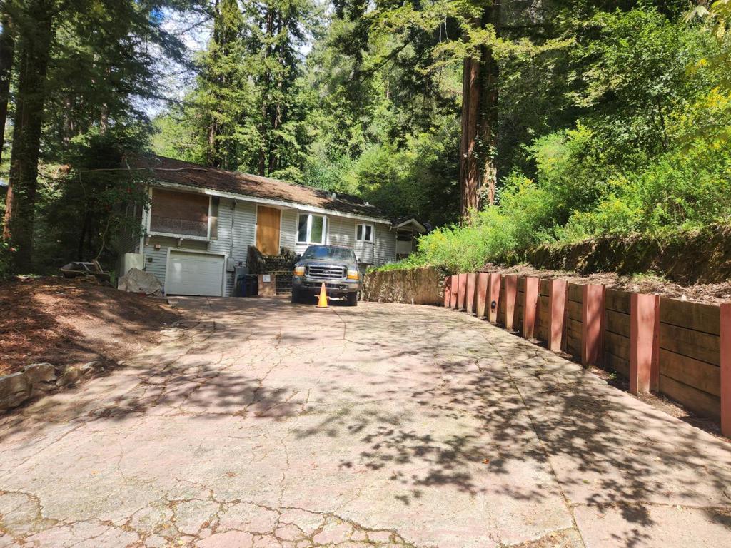 Price Drop! Very Motivated Sellers! Contractors Dream! Riverfront Retreat in Downtown Boulder Creek! With a little vision and TLC, this riverfront gem could become your dream home! Nestled along the scenic San Lorenzo River, this 2-bedroom, 2-bath home offers stunning views of Barbara Day Park and the perfect blend of privacy and convenience. The spacious living room and galley kitchen provide a great foundation for renovation, while the expansive lot offers direct, private river access. Enjoy the best of both worlds, seclusion with no visible neighbors, yet just a short stroll to downtown shops, dining, and amenities. Don't miss this rare opportunity to create your own slice of paradise!