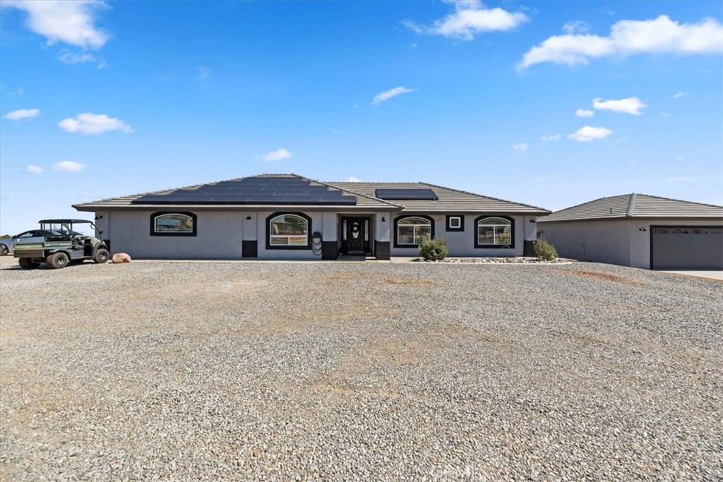 This Custom West Oak Hills Home sits on 2.27 Acres of Fully Fenced Property with a 2 Car Attached Garage, a 2 Car Detached Garage with its own Septic Tank and Bathroom and a 1500 Square Foot RV Garage Workshop with Electricity and 50 amp RV Outlet Hook Up. Electric Gate, Public Gas (Not Propane) and SOLAR THAT IS PAID! Open Concept Floorplan with Custom Arches, Vaulted Ceilings and Electric Wood Burning Stove. Spacious Bedrooms with Mirrored Closet Doors and Ceiling Fans. Split Floor Plan with Indoor Laundry. Master Suite has Jacuzzi Tub, Dual Sinks and Huge Walk in Closet. Covered Stucco Patio and Play Area.
