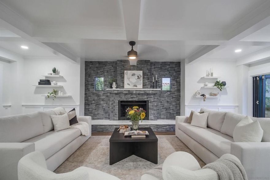 Timeless elegance offering a generous family compound on the iconic and tree-lined Sunset Blvd, located in the highly sought after North Mission Hills community. Stunning coffered ceilings, a showcase fireplace, and LaCantina doors provide a seamless indoor and outdoor, open-concept dining and living atmosphere. Entertain loved ones in a chef’s kitchen, sip tea at the breakfast bar, and create your plant loving, book reading sanctuary in the charming sunroom with picturesque bay windows looking out on views of the community!  A canvas for outdoor enthusiasts, garden lovers, pet lovers, and children awaits in the expansive tree-shaded backyard that offers terraced landscaping and is fully fenced with additional parking! Upstairs, four spacious bedrooms await, including a primary retreat with a zen inspired soaking tub and walk-in shower room. The third floor flex room is the perfect den for crafts, a playroom, or additional storage. Perched above a rare detached 3 car garage is a one bedroom, one bathroom ADU with a kitchenette and its own balcony and entry! Perfection awaits for multi-generational families in need of a separate second home or a buyer desiring a robust rental income - the options are unlimited! The magical and historic Mission Hills neighborhood is a central yet quaint metro San Diego location that offers good schools, award-winning eateries, treasured parks, stunning architecture, and local shops right outside your front door.