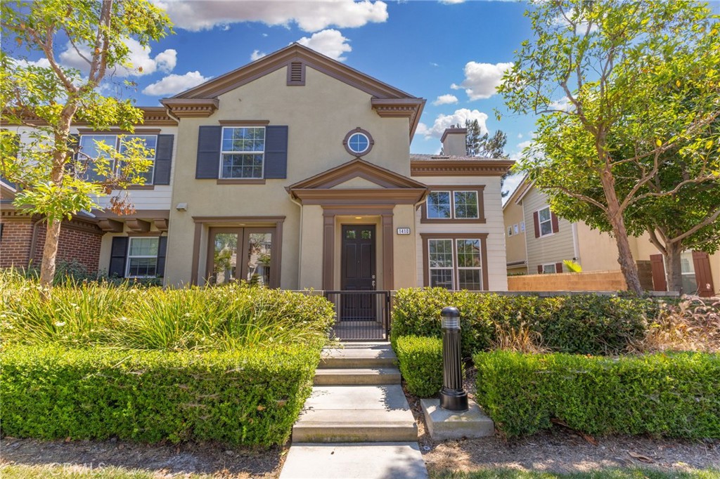 Welcome home to 1410 Lexington St, an elegant 3-bed, 3-bath, 2,000 sq ft single-family residence built in 2007 and set on a tree-lined street in coveted Tustin. Manicured hedges, a classic Colonial-inspired façade, and sun-filled rooms create irresistible curb appeal while delivering modern comfort inside.
The gourmet kitchen showcases slab-granite counters, a full backsplash, rich espresso cabinetry, and stainless-steel appliances including a five-burner gas range, built-in microwave, French-door refrigerator, and dishwasher. A breakfast bar opens directly to the main living space, keeping conversations flowing during casual gatherings. The open-concept living and dining area offers soaring ceilings, recessed lighting, and French doors that spill out to a private patio for seamless indoor–outdoor living.
Upstairs, a versatile loft features custom built-in cabinetry perfect for a home office, homework station, or creative studio. The primary suite is a true retreat with a generous bedroom, walk-in closet, dual-sink vanity, soaking tub, and separate shower. Two additional spacious bedrooms, a full hall bath, and a convenient downstairs guest bath complete the thoughtful layout.
Recent upgrades include engineered hardwood flooring, plush neutral carpet, dual-pane windows, an indoor laundry room, freshly painted interiors, and an attached two-car garage with direct entry and extra storage. Minutes from The District at Tustin Legacy, The Market Place, top-rated Tustin USD schools (including Beckman High School), parks, dining, and major arteries like the 5/55/405 freeways, 261 Toll Road, and John Wayne Airport, this home offers an effortless Southern California lifestyle.