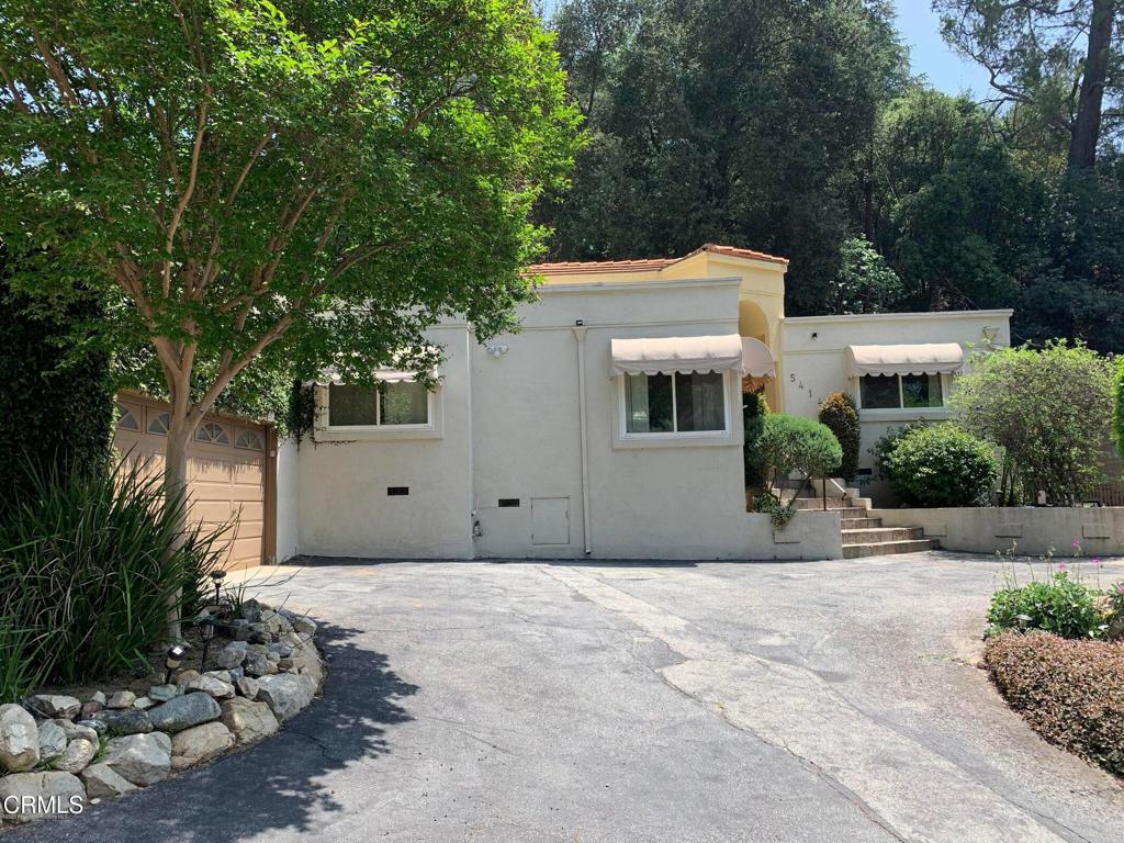 La Canada Schools! Located high in the lovely Deodar Area of La Canada sits this wonderful get away. This remodeled home offers nearly 2600 sqft. (including a detached room w/ separate access that is perfect for an at-home office or gym .) Features include a formal entry, updated kitchen complete with stainless steel appliances and granite counters, breakfast room, separate den, formal dining room, large, open living room w/ floor-to-ceiling windows, fireplace and wet bar. There are 3 generously-sized bedrooms including a spacious primary suite w/ private bath. Other features include hardwood floors, high ceilings, ca/fa, laundry room, attached 2-car garage w/ direct house access and a private, quiet landscaped rear yard with Fugi apple, tangerine, lime and lemon trees!